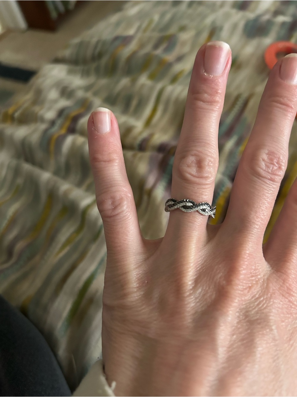 14k white gold infinity band with black and white diamonds